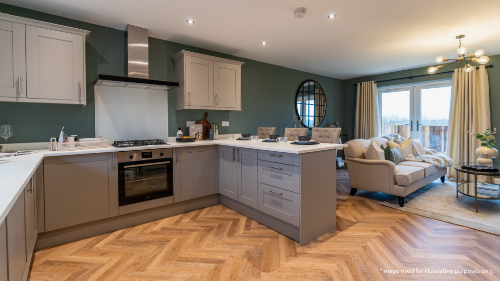 Grey kitchen with sofa and french doors in background